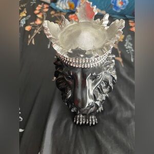 There are two lions and two elephants

An elephant's back is silver